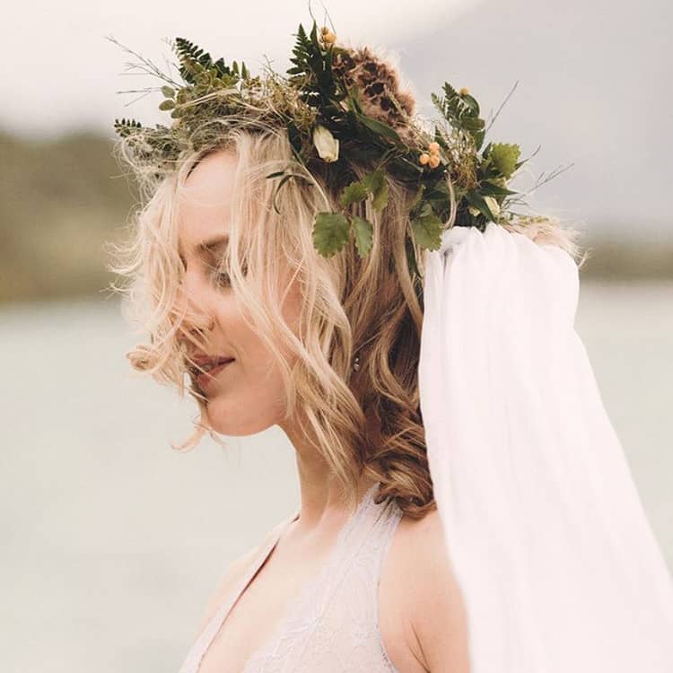 bride in wildflower crown with veil