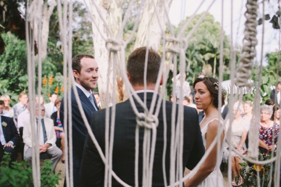 Macramé wedding aisle backdrop | Photography by Lara Hotz