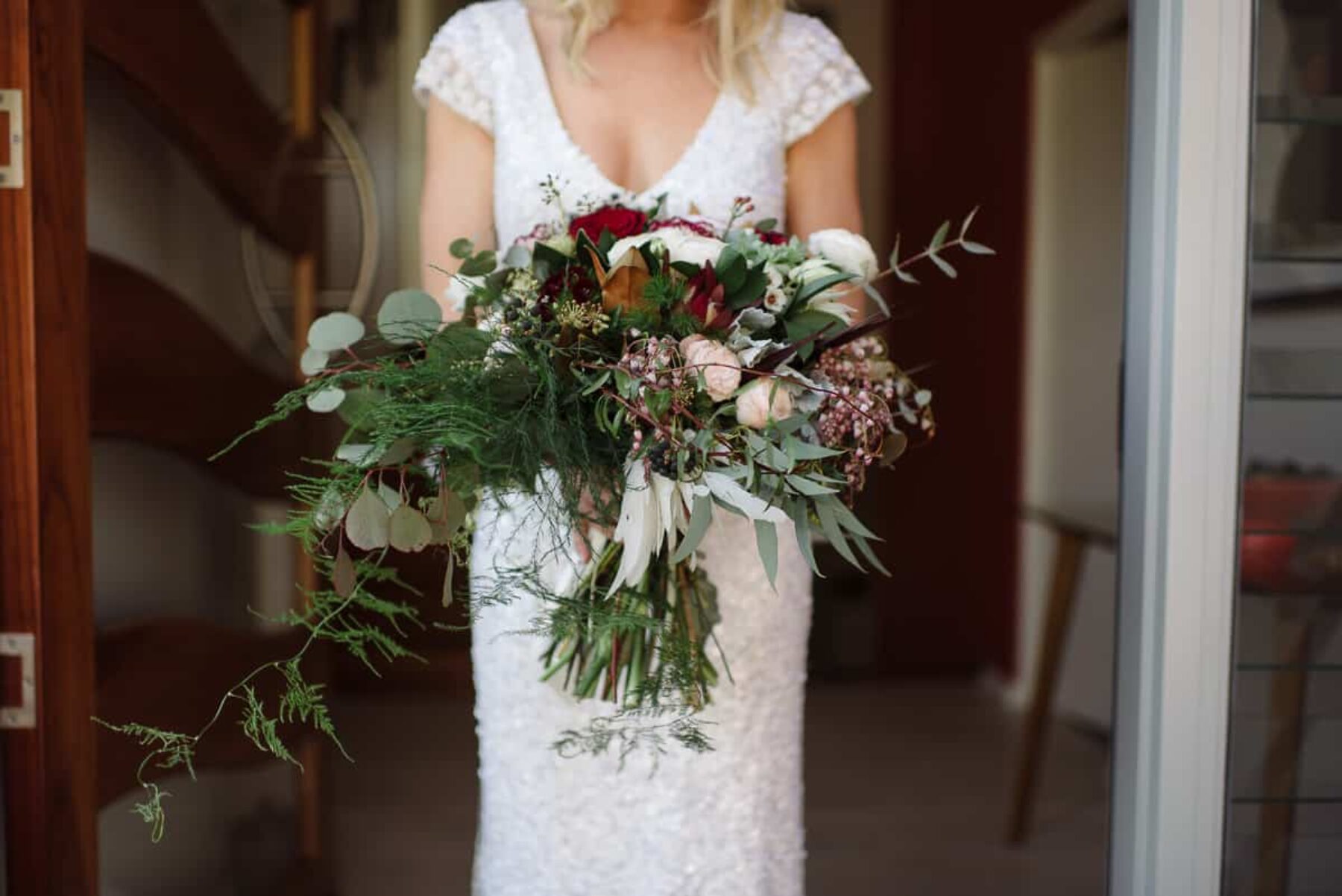 Karen Willis Holmes wedding dress / autumnal burgundy bouquet