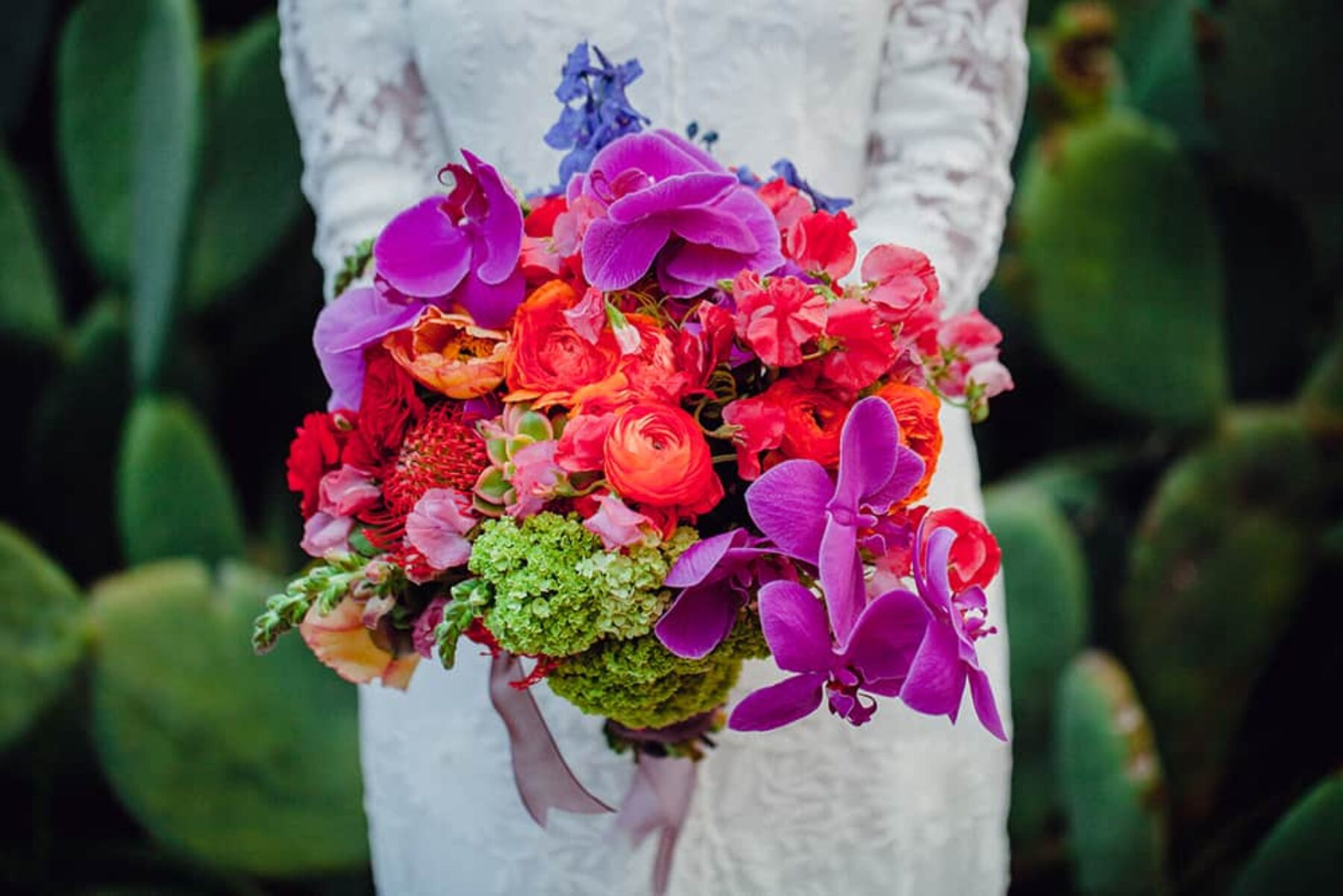 jewel-toned orchid and ranunculus wedding bouquet
