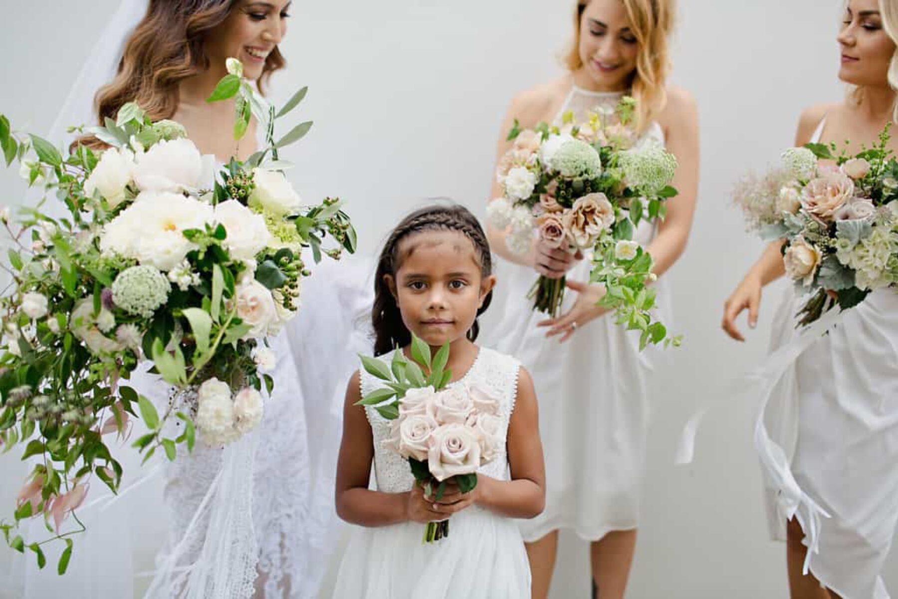 bridesmaids and flower girl in white