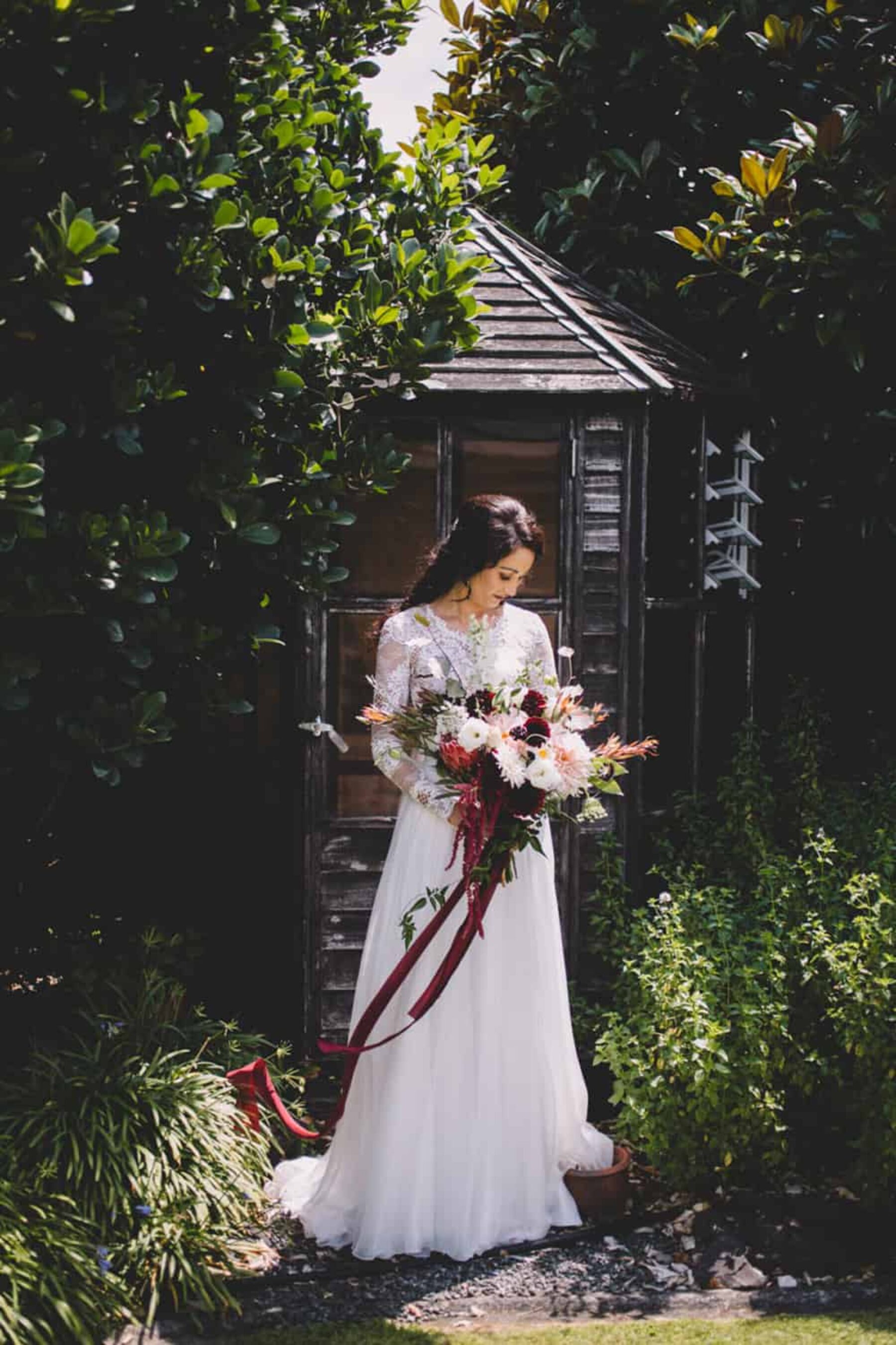 bride with marsala bouquet