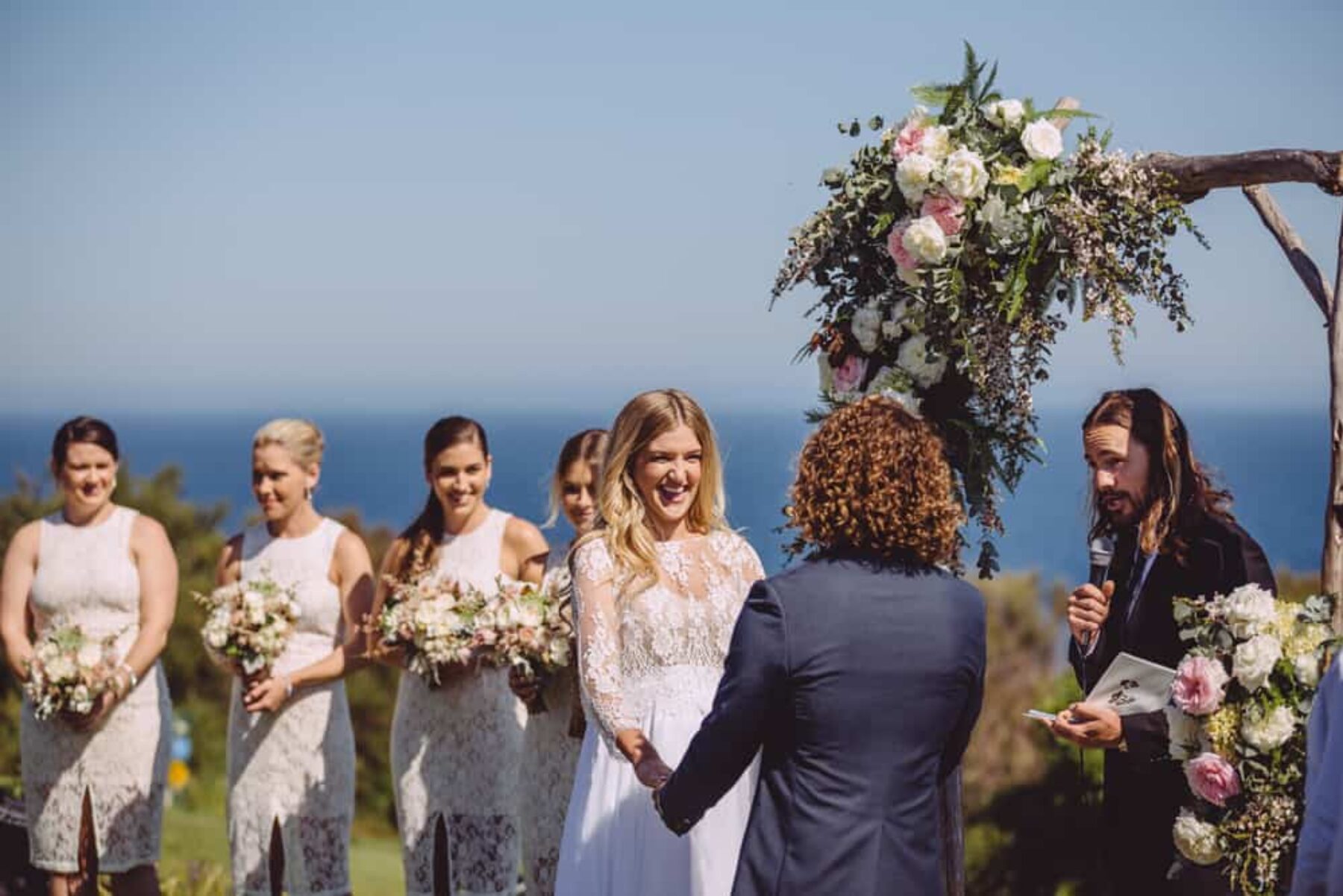 beach wedding with timber floral arch
