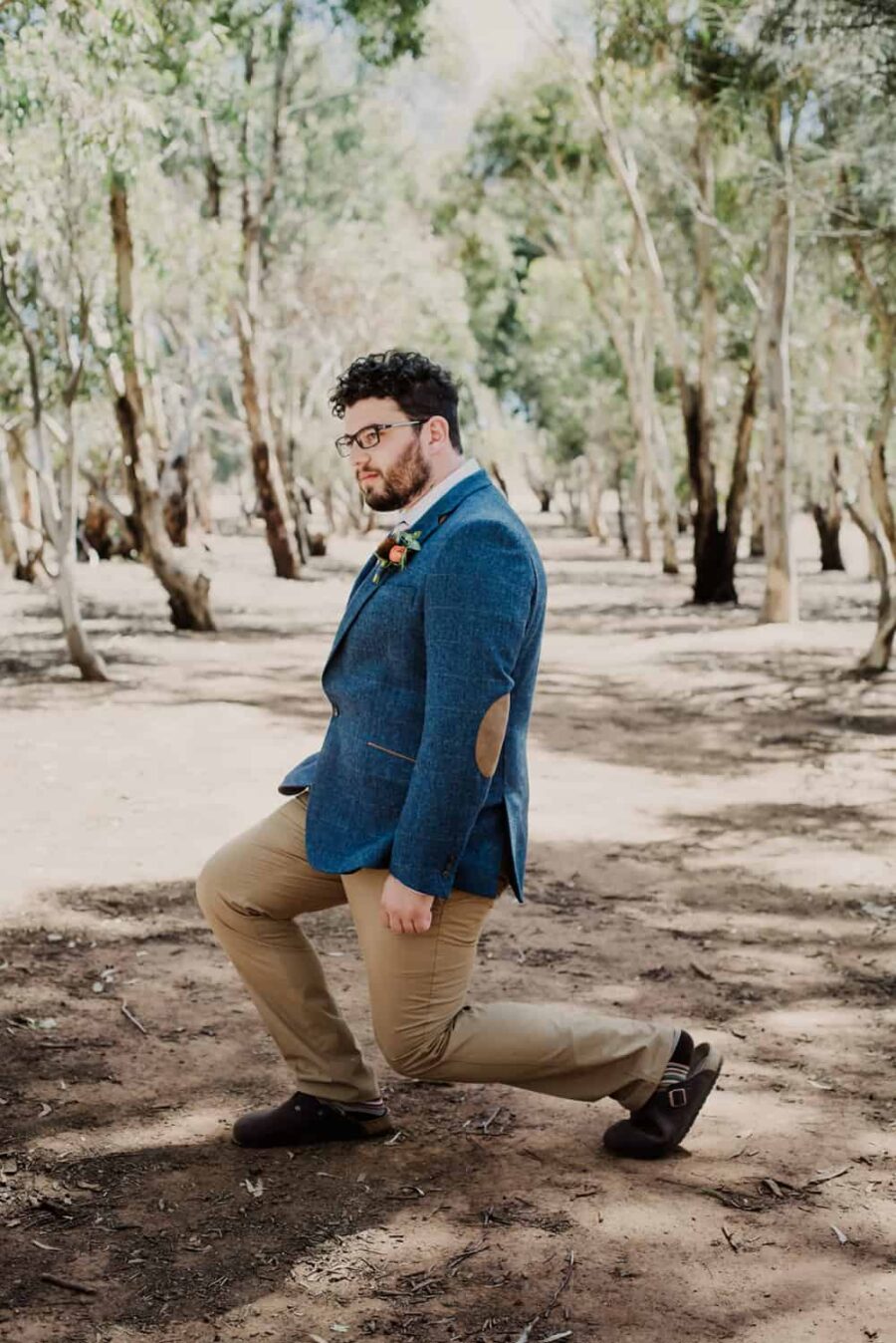 groom in blue and tan