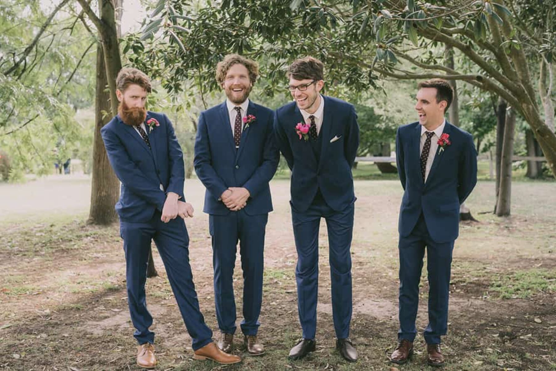 groomsmen in navy suits