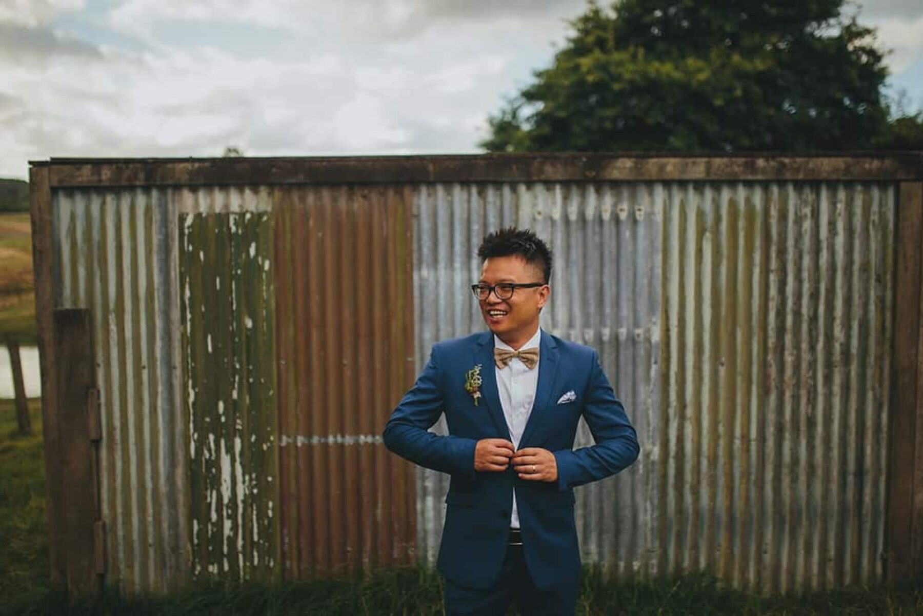 stylish groom in glasses