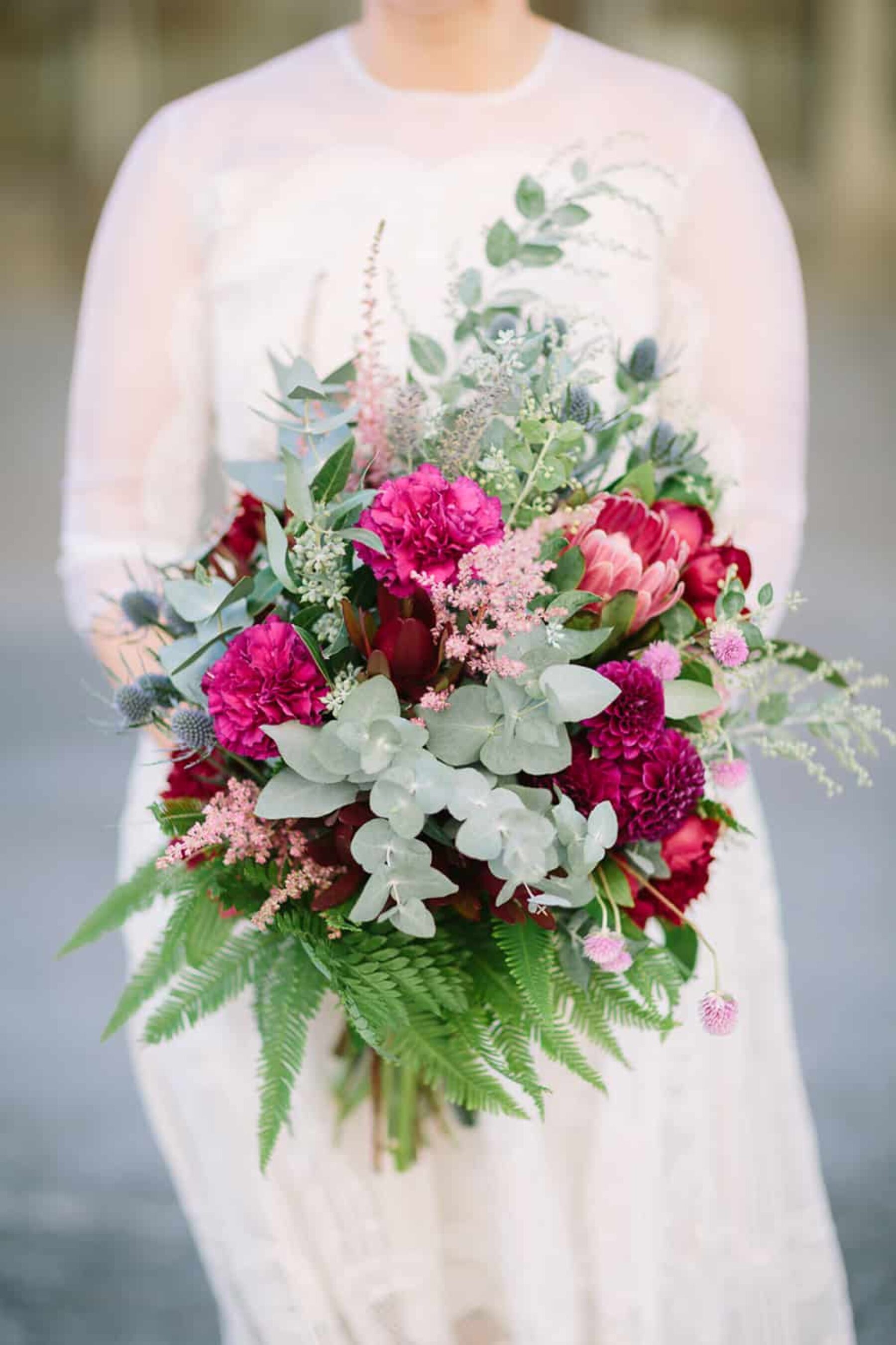 magenta bouquet with native foliage