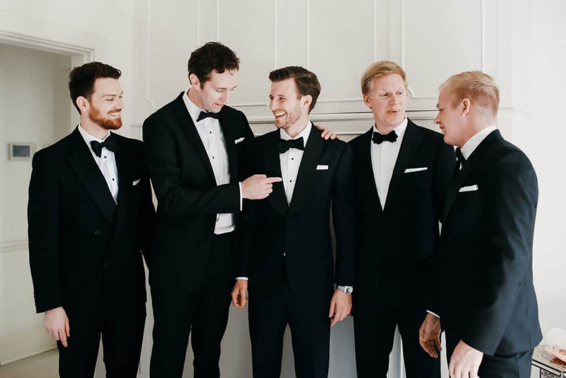 groom and groomsmen in classic tuxes