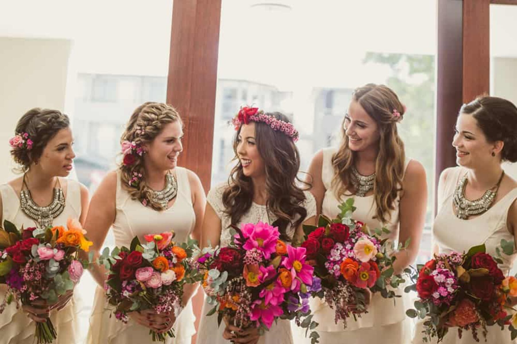 bride and bridesmaids with vibrant bouquets
