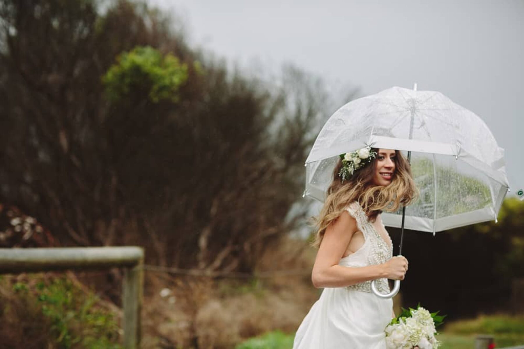boho bride with clear umbrella