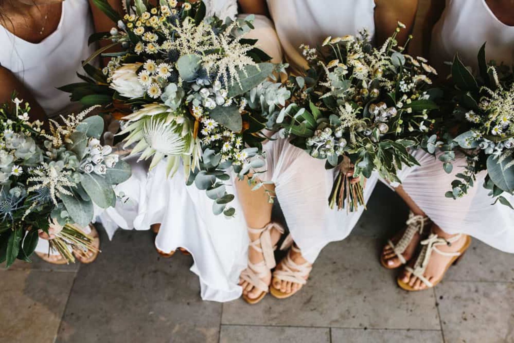 bridesmaids with green and white bouquets