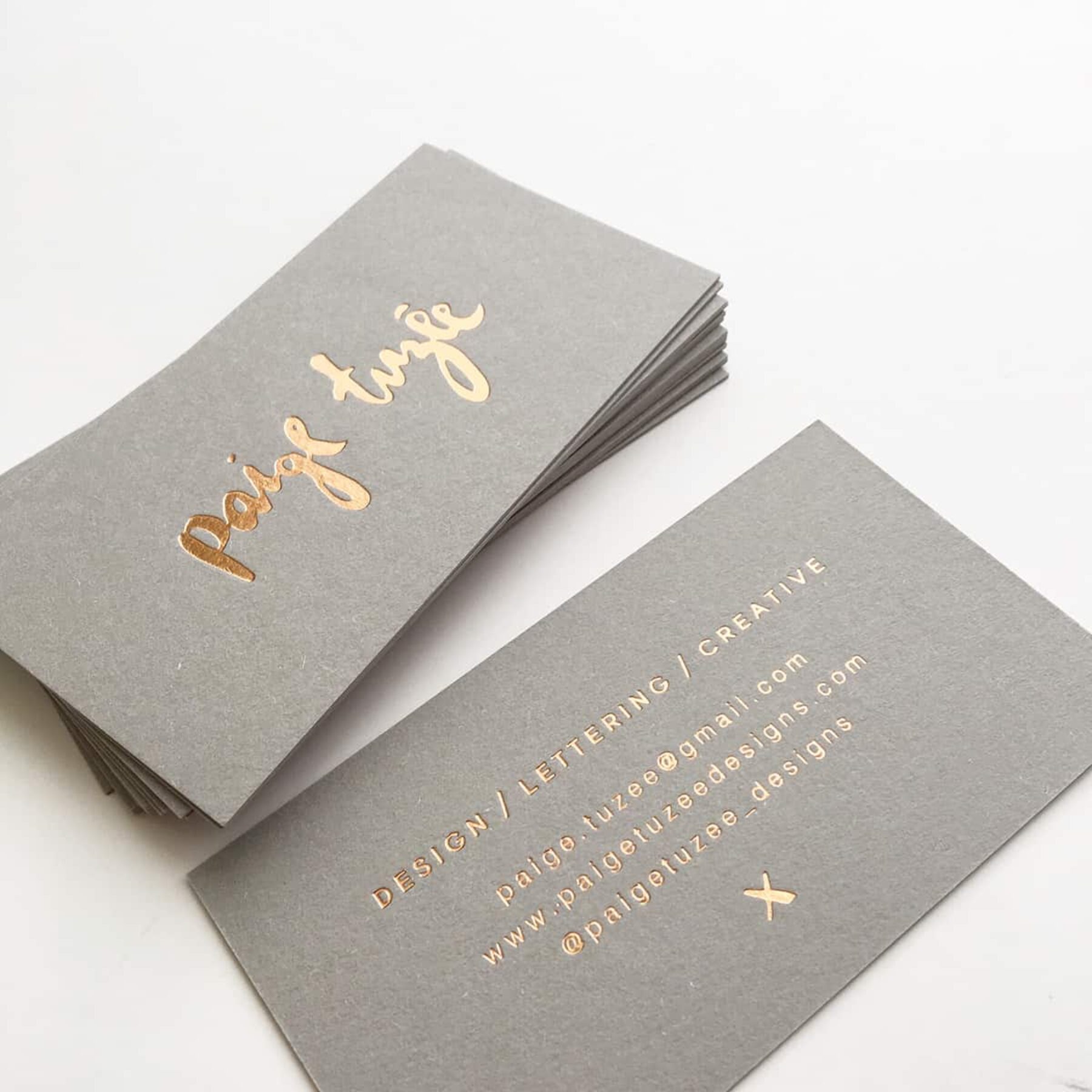 gold-foiled letterpress business cards by Paige Tuzee