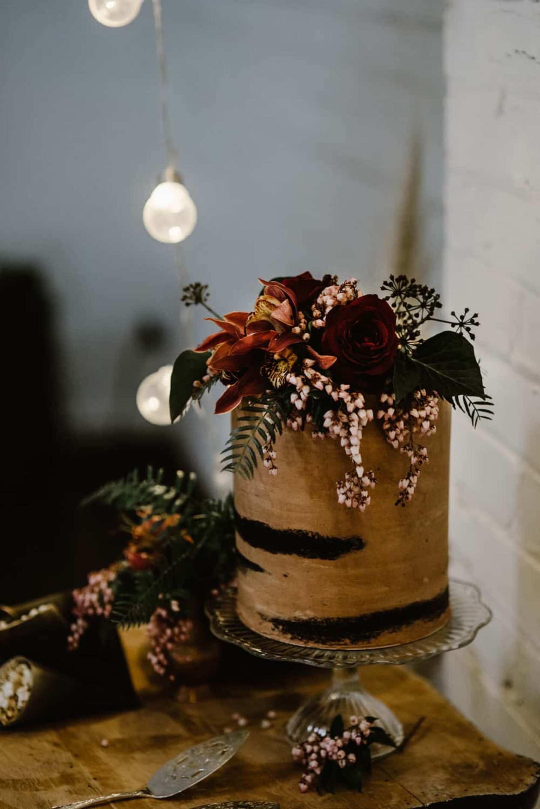 nearly-naked chocolate cake with fresh flowers