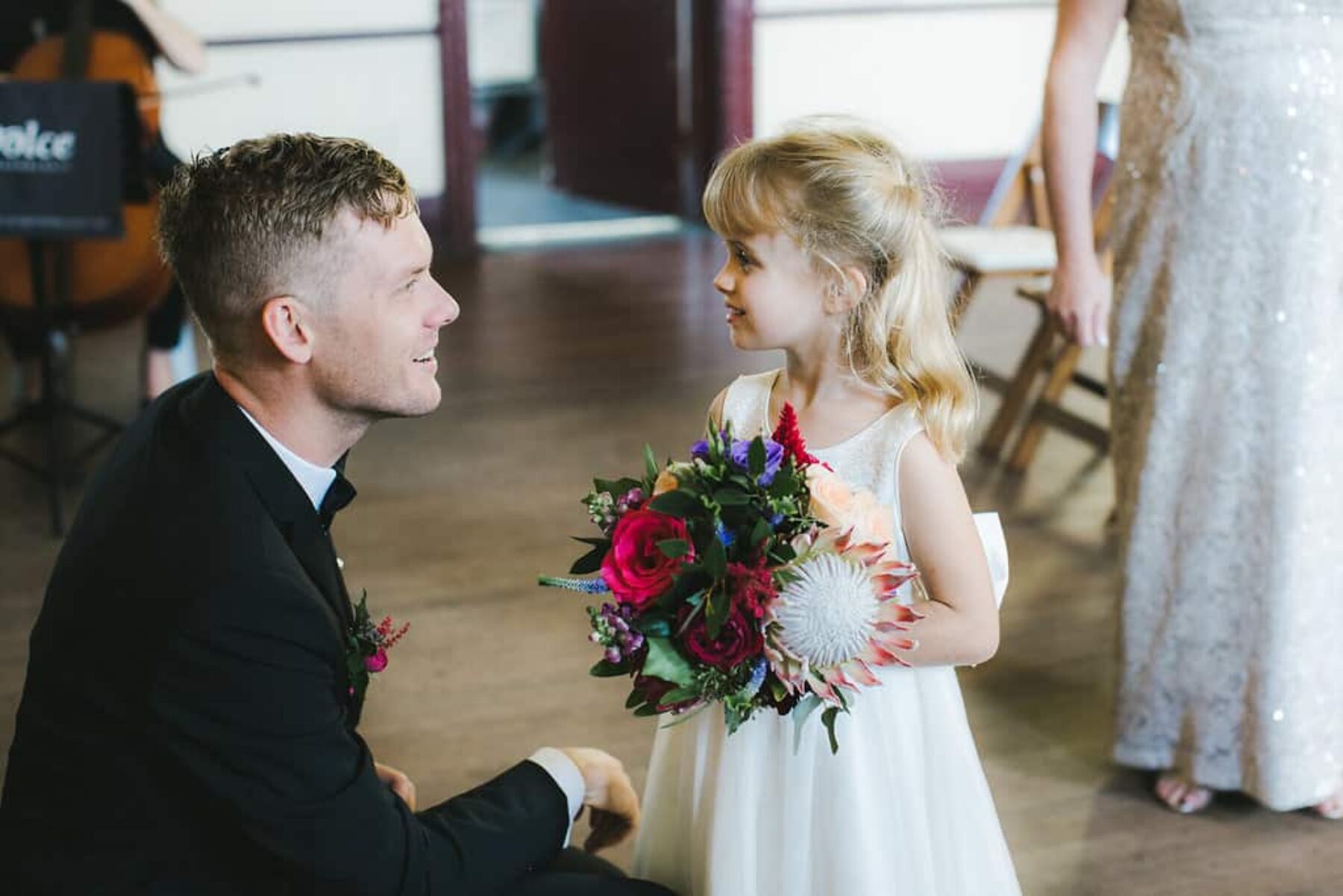 flower girl with protea bouquet