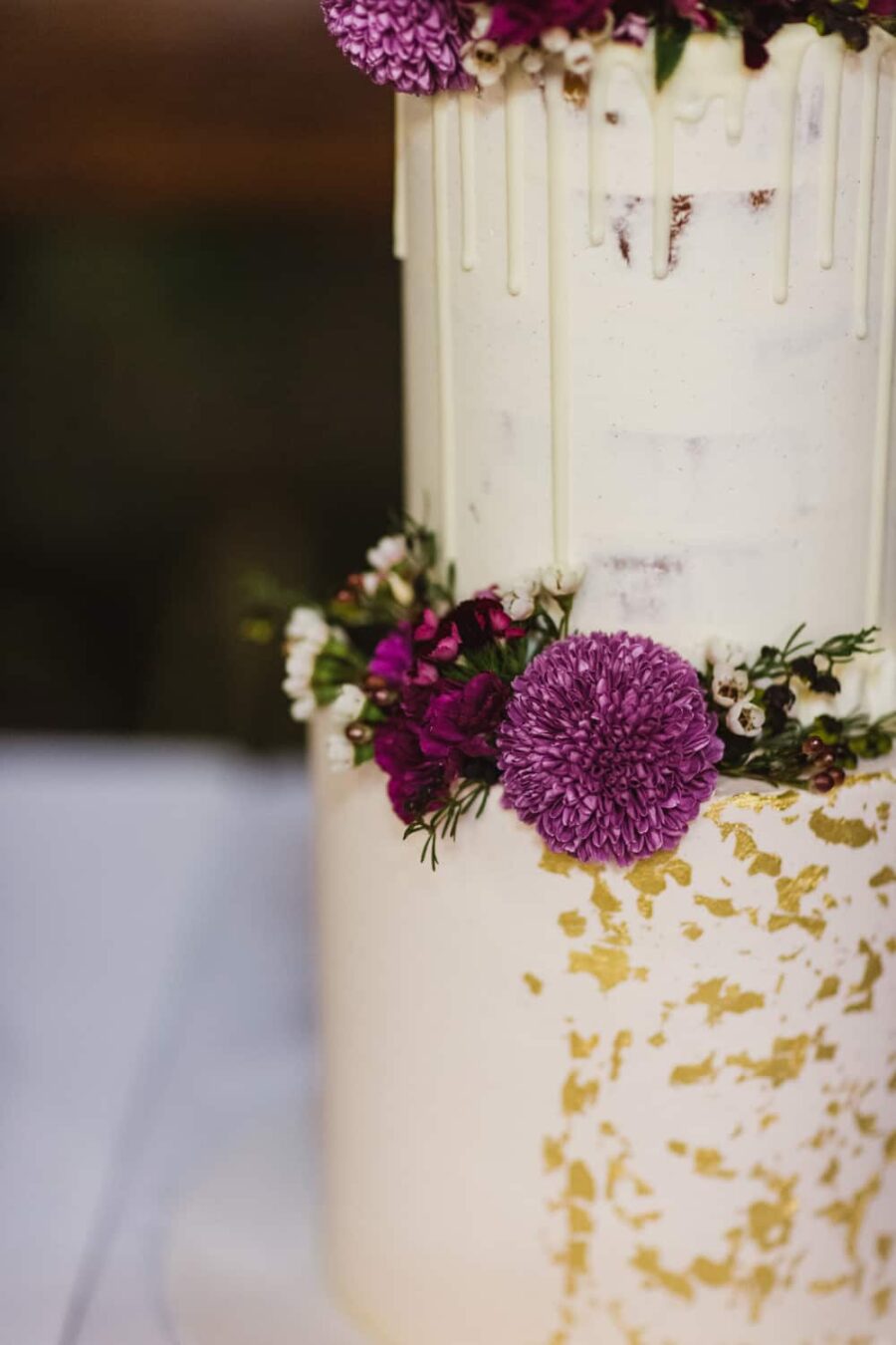 gold leaf wedding cake with magenta flowers