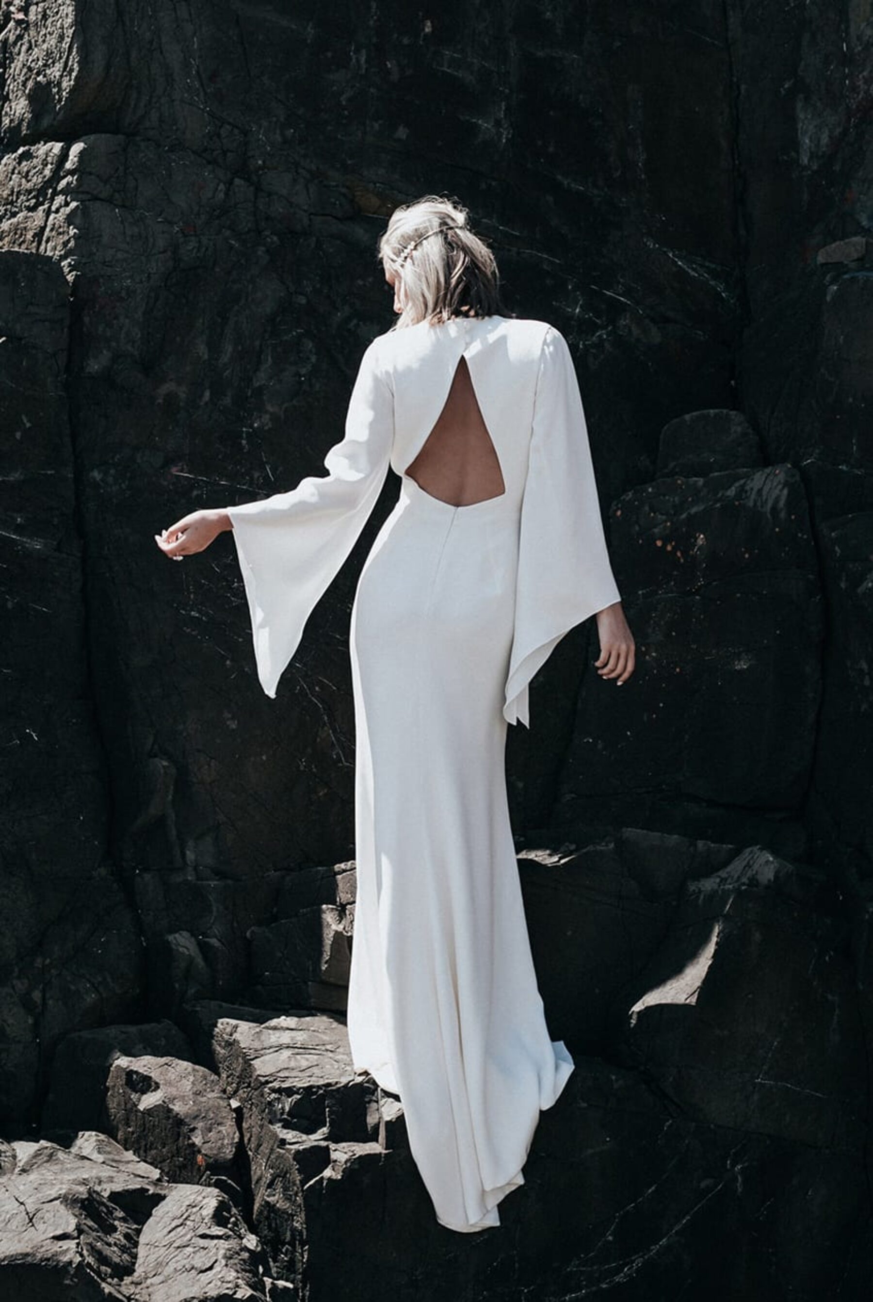 modern backless wedding dress with bell sleeves by Prea James Bridal