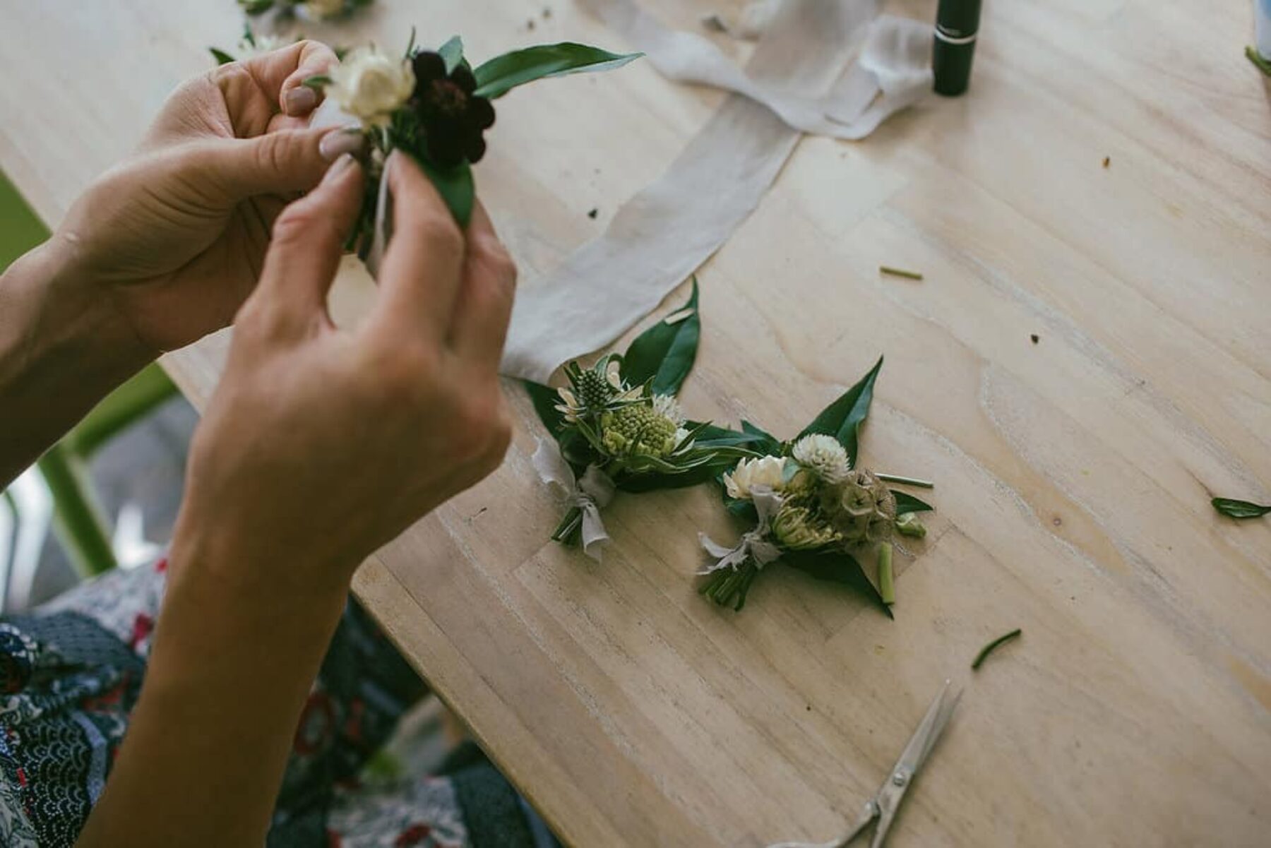 green and white boutonniere