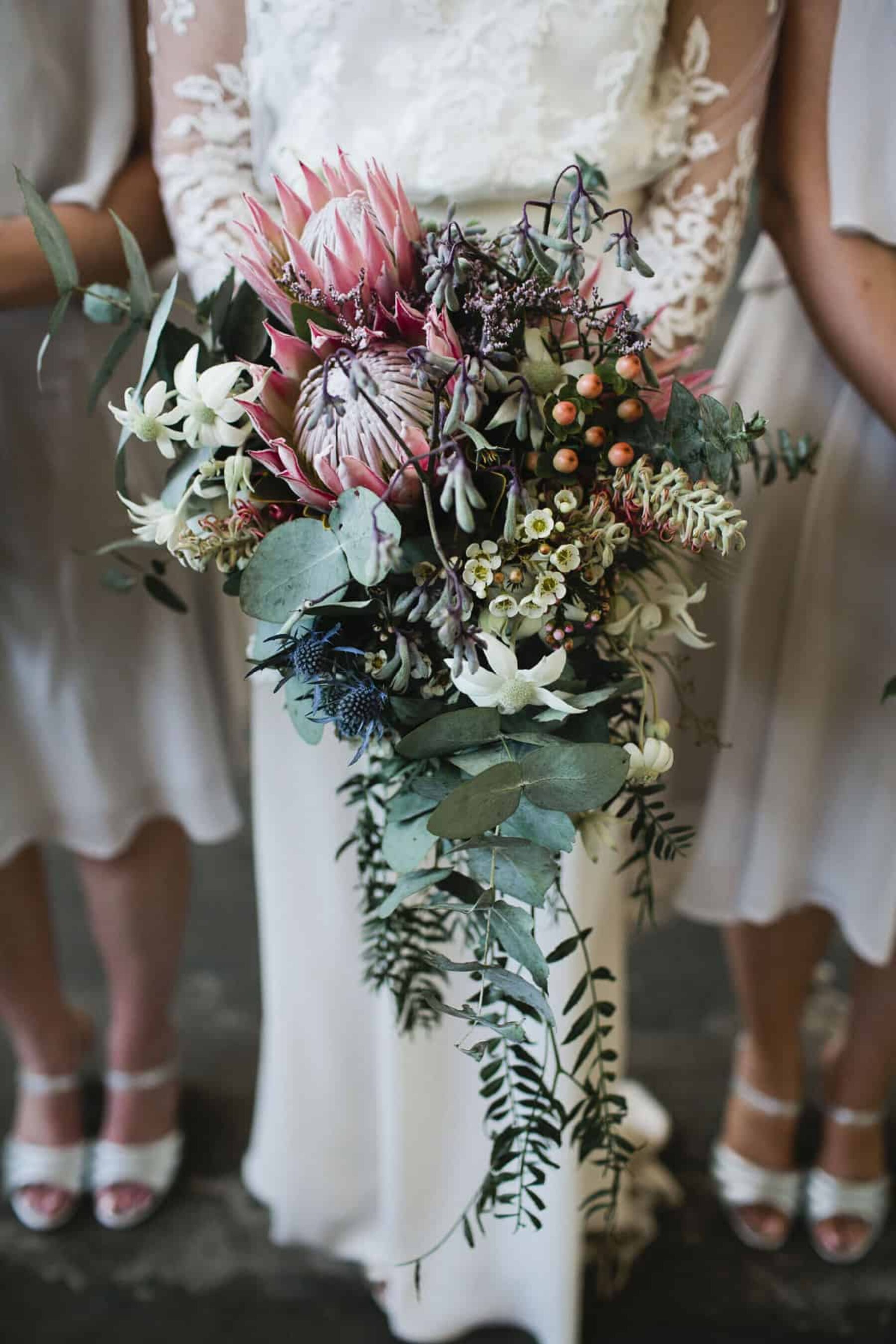 cascading native bouquet with pink proteas