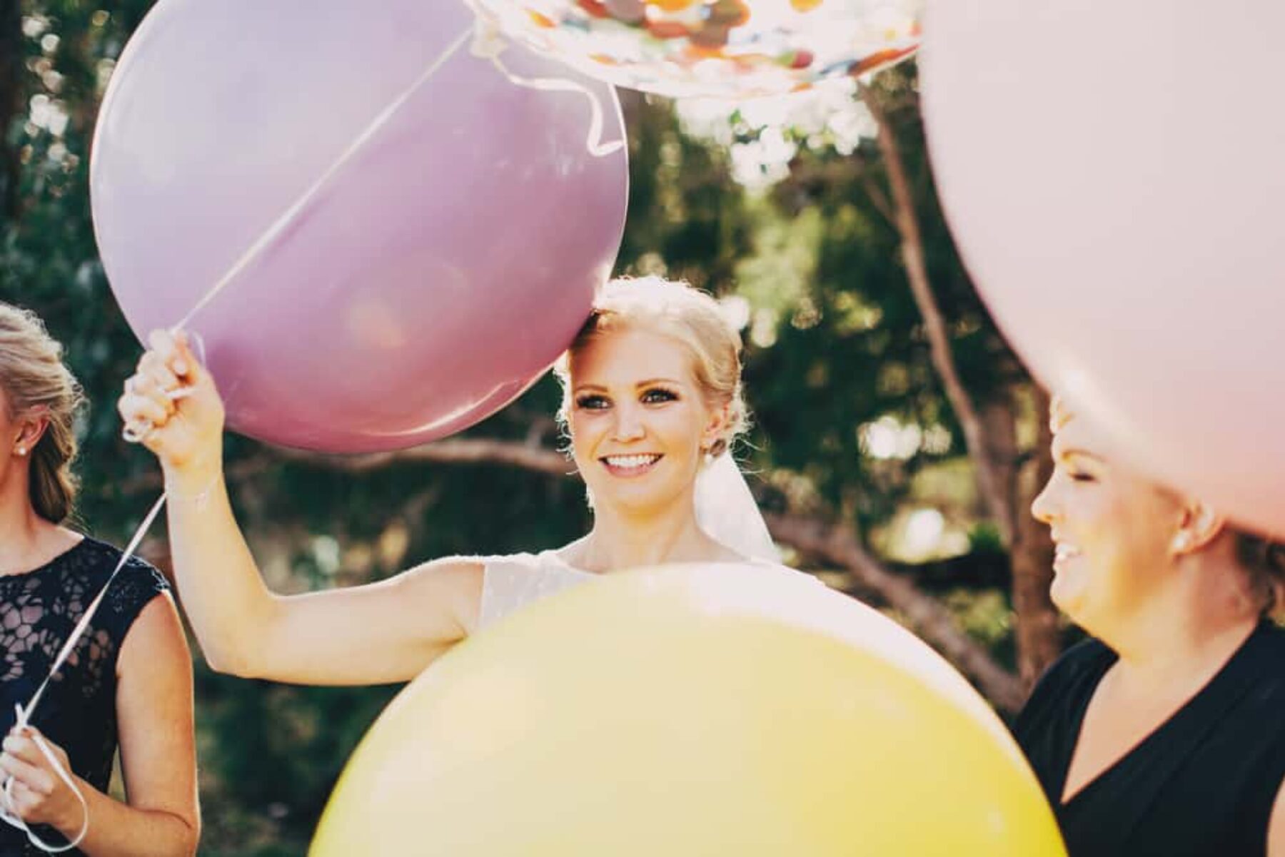 bride with giant colour balloons