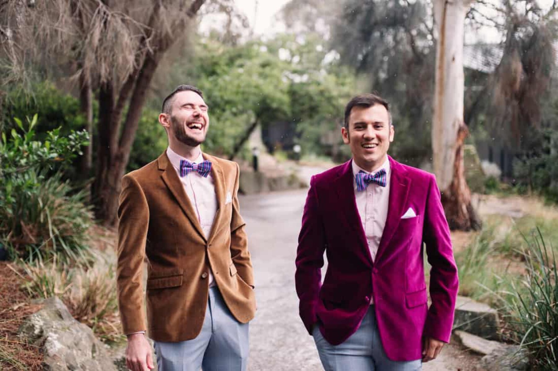 stylish groom and best man in velvet blazers and bow ties