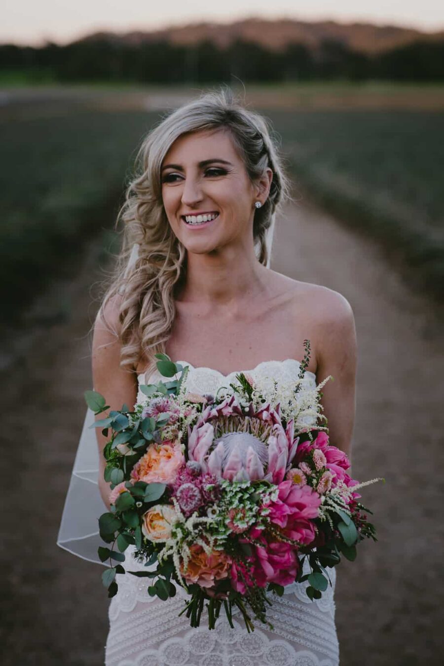 gorgeous bride with protea bouquets