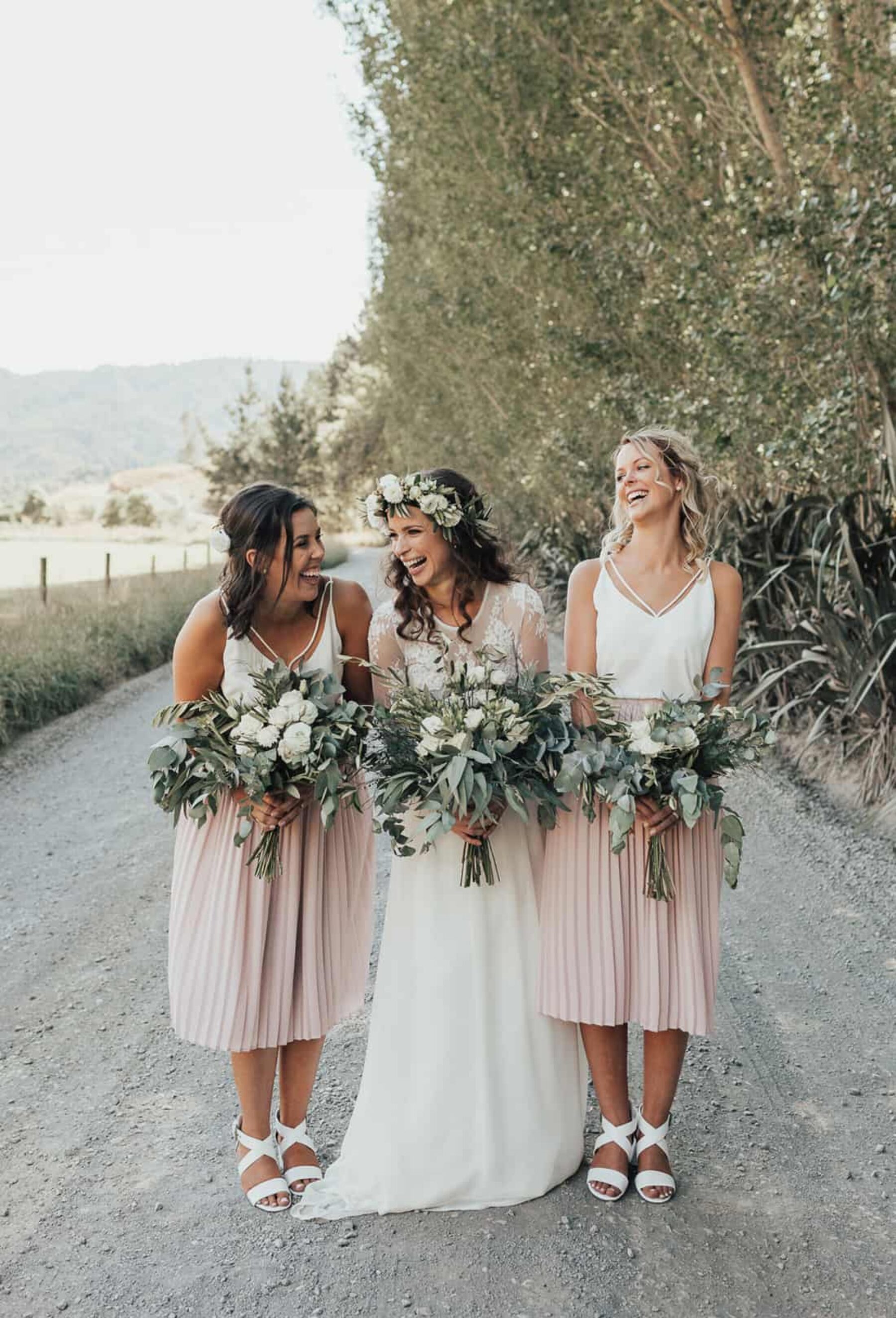 boho bride and bridesmaids with green and white bouquets