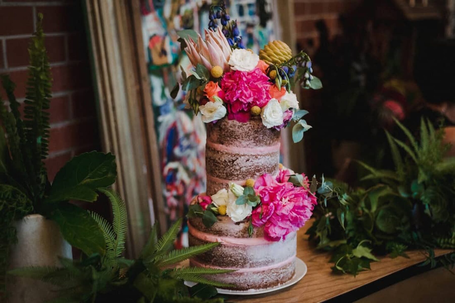 vegan pink wedding cake with gorgeous fresh flowers