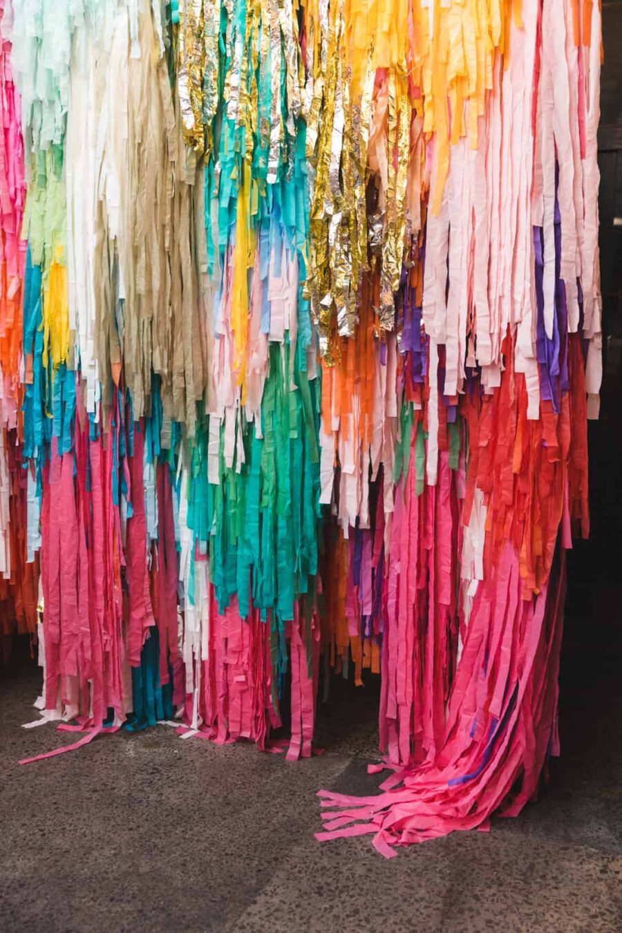 colourful streamer wedding backdrop