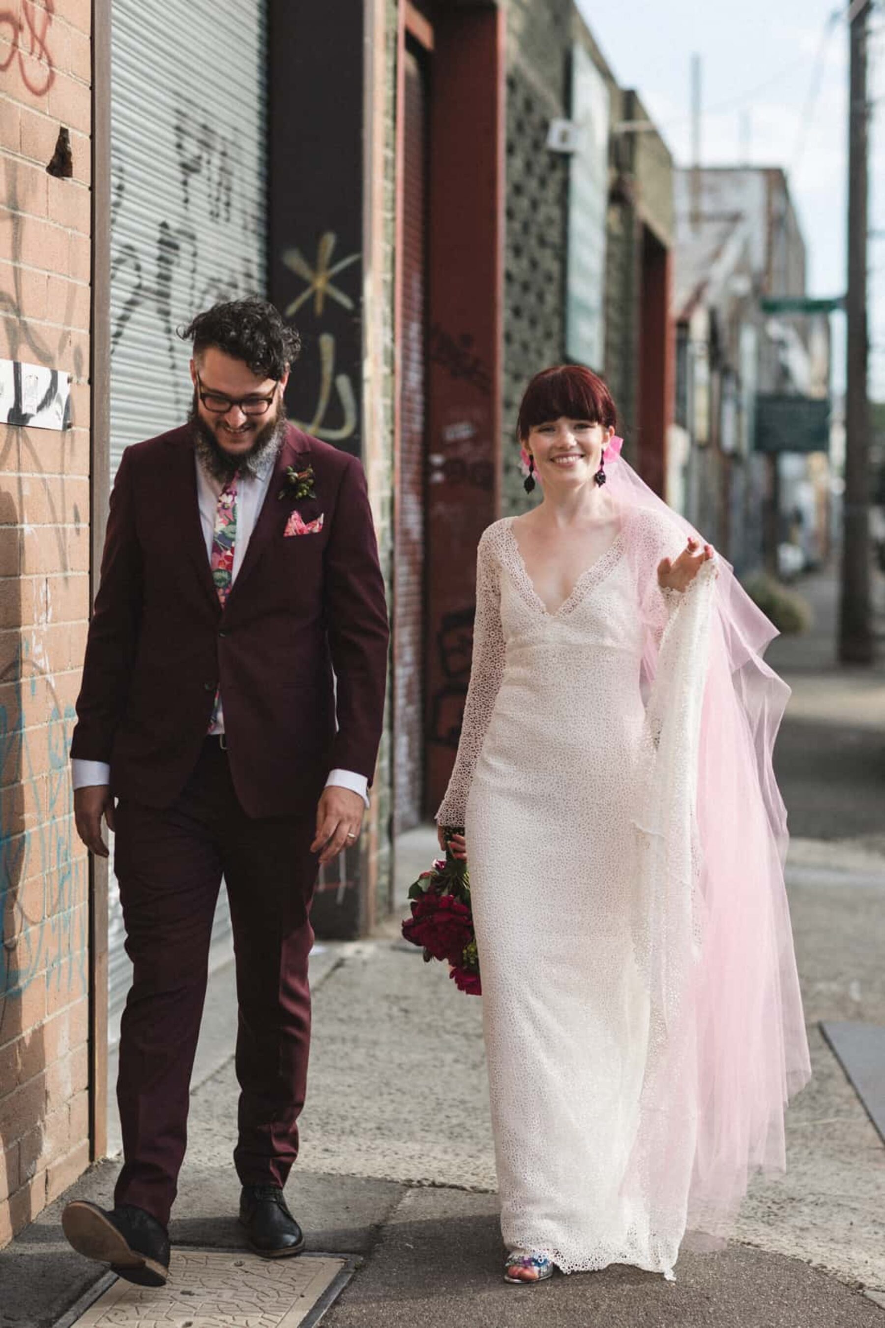 bearded groom and bride with pink tulle veil