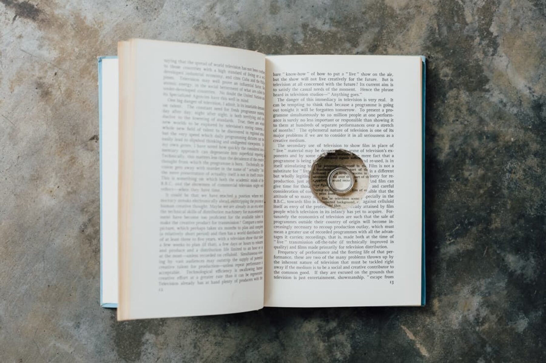 wedding bands in cut-out hollow of book