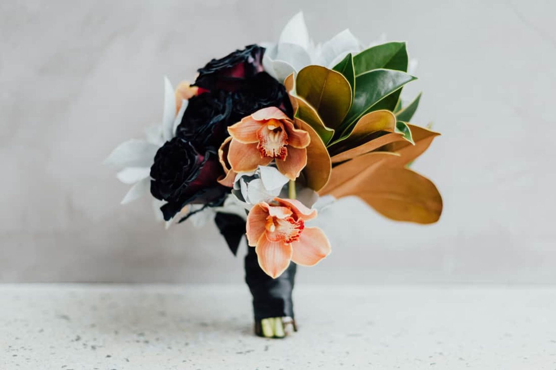 black and copper wedding bouquet with orchids