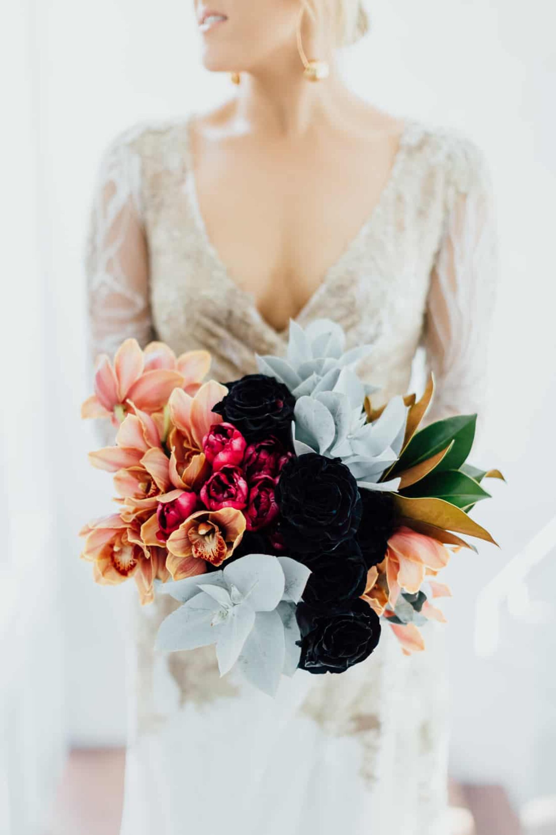 black and copper wedding bouquet with orchids