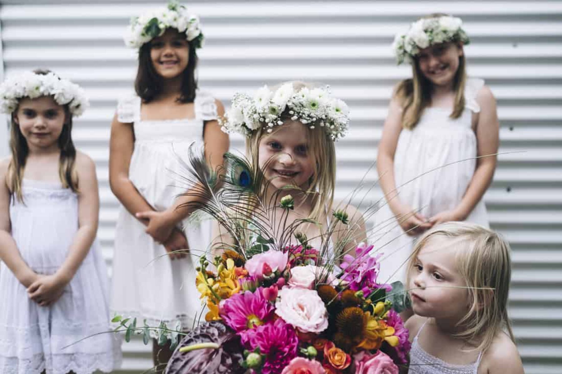 flower girls with white flower crowns