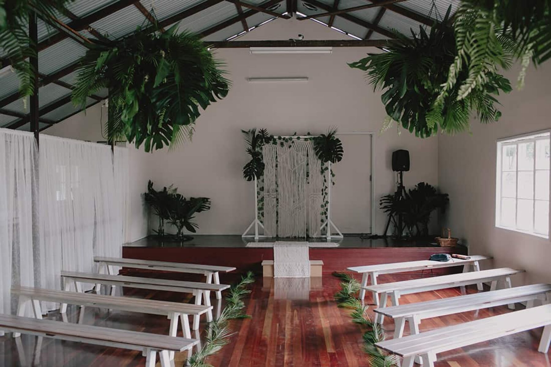 modern greenery wedding with macrame backdrop