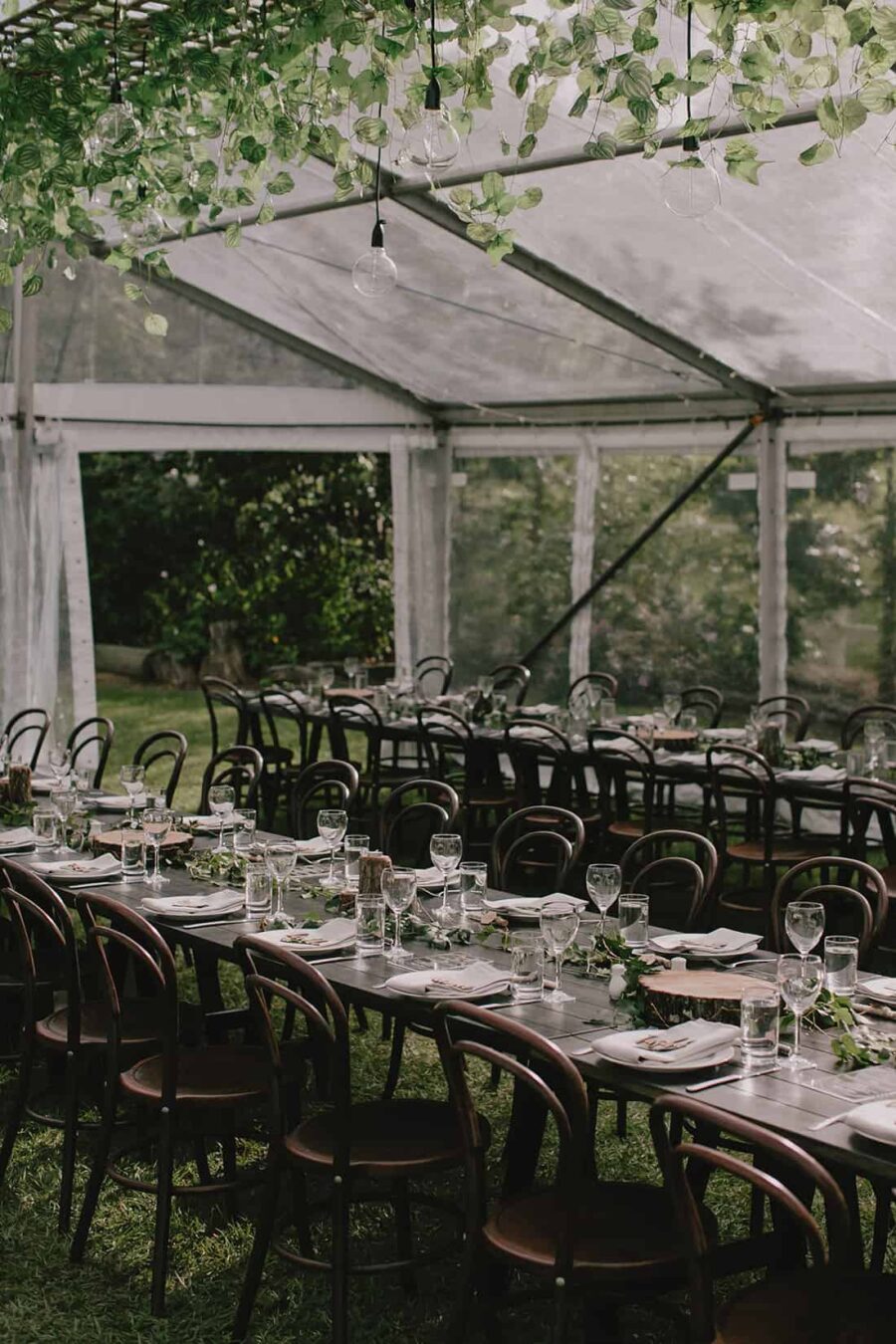Modern marquee wedding filled with lush greenery