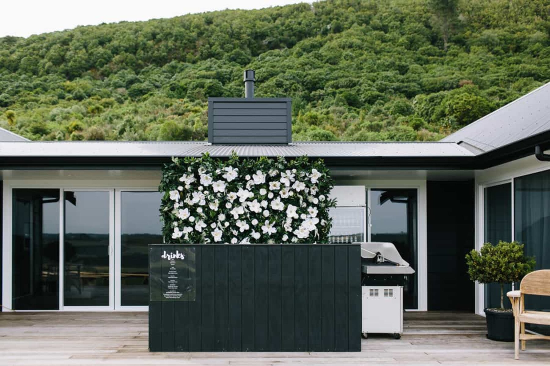 outdoor bar with flower wall