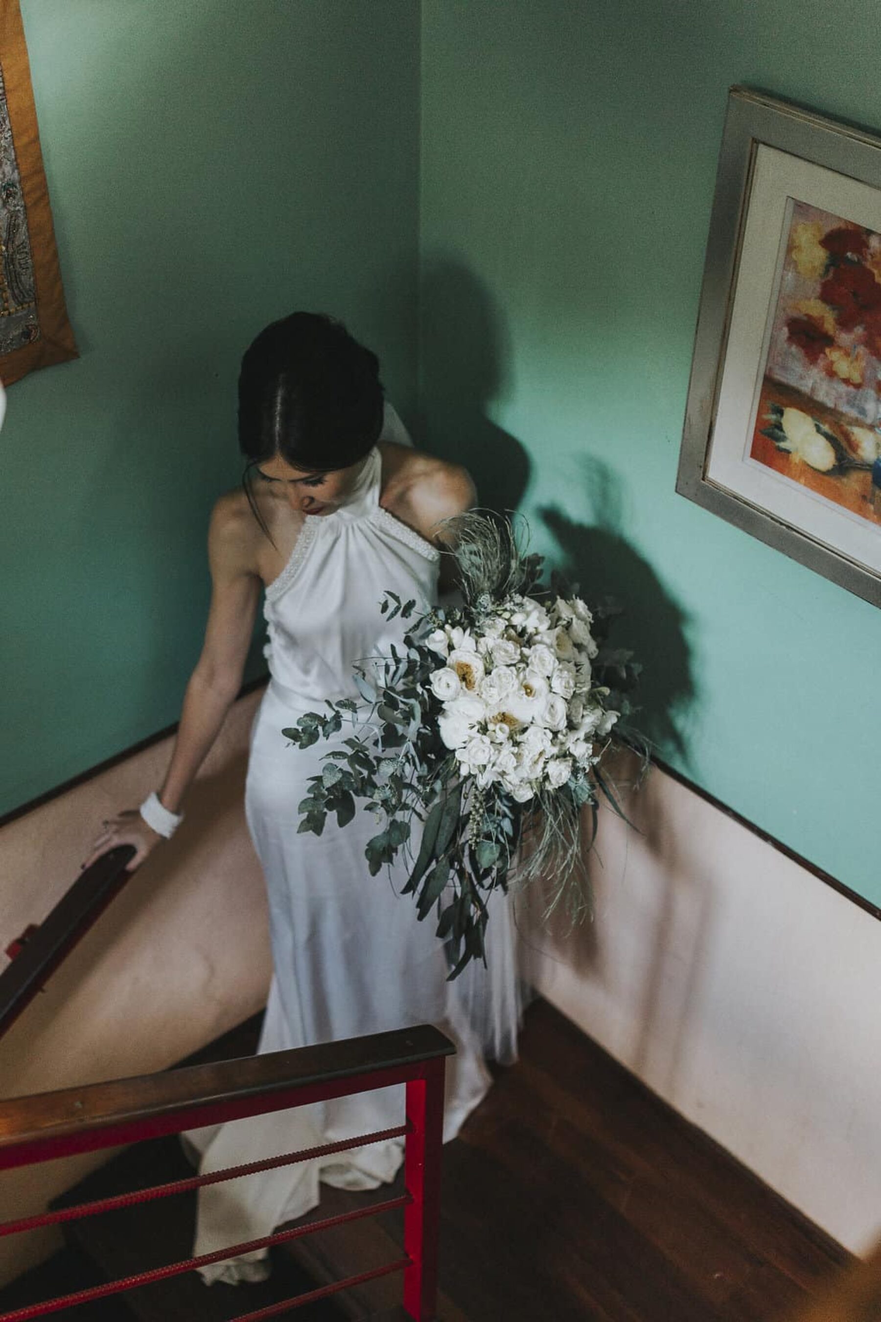 modern bride with unstructured green and white bouquet