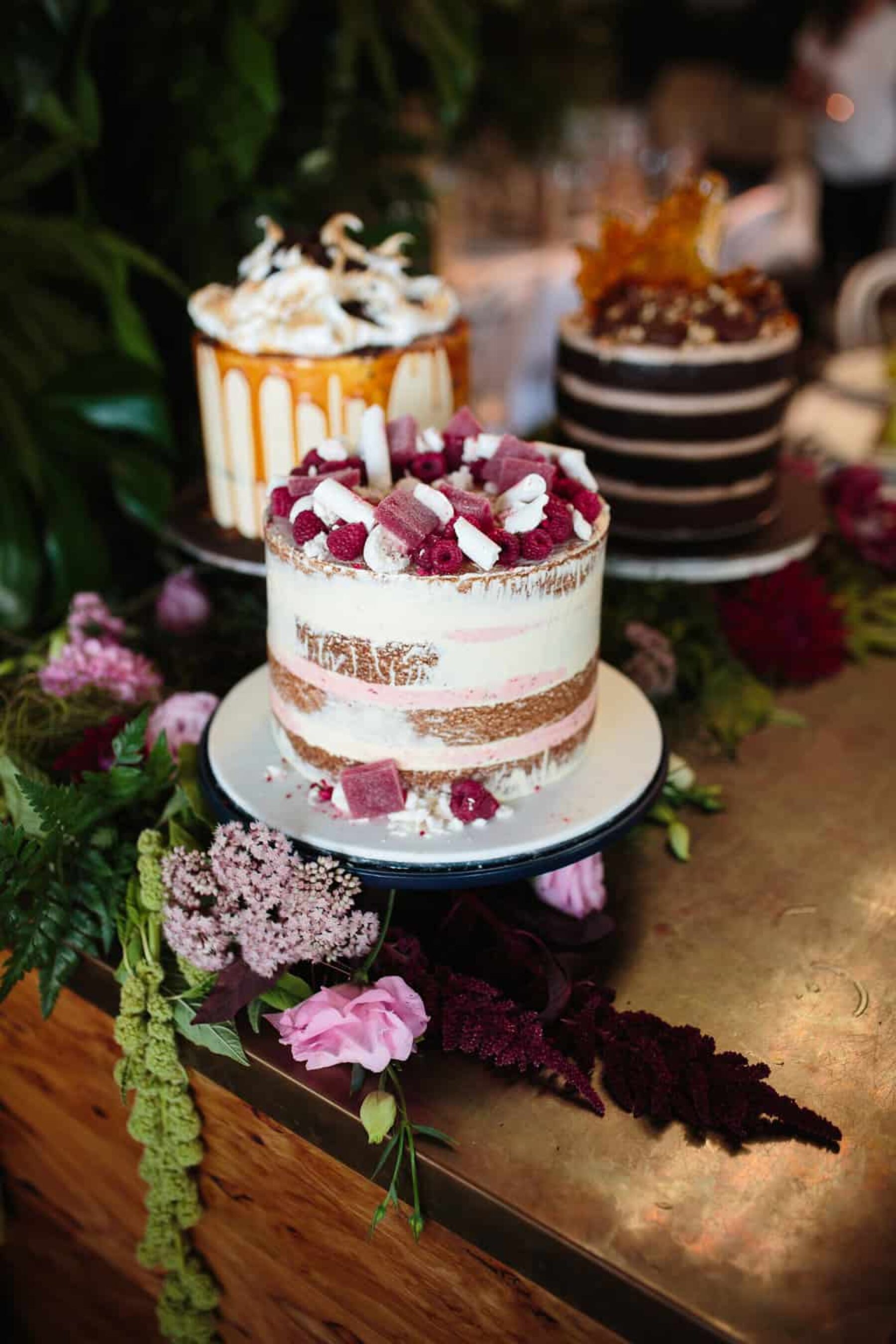 trio of unique wedding cakes