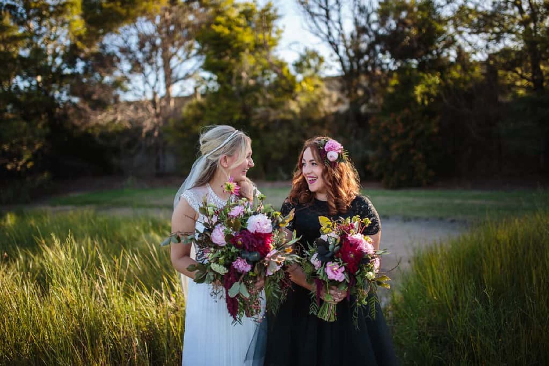 bride + bridessmaid with mixed pink bouquets