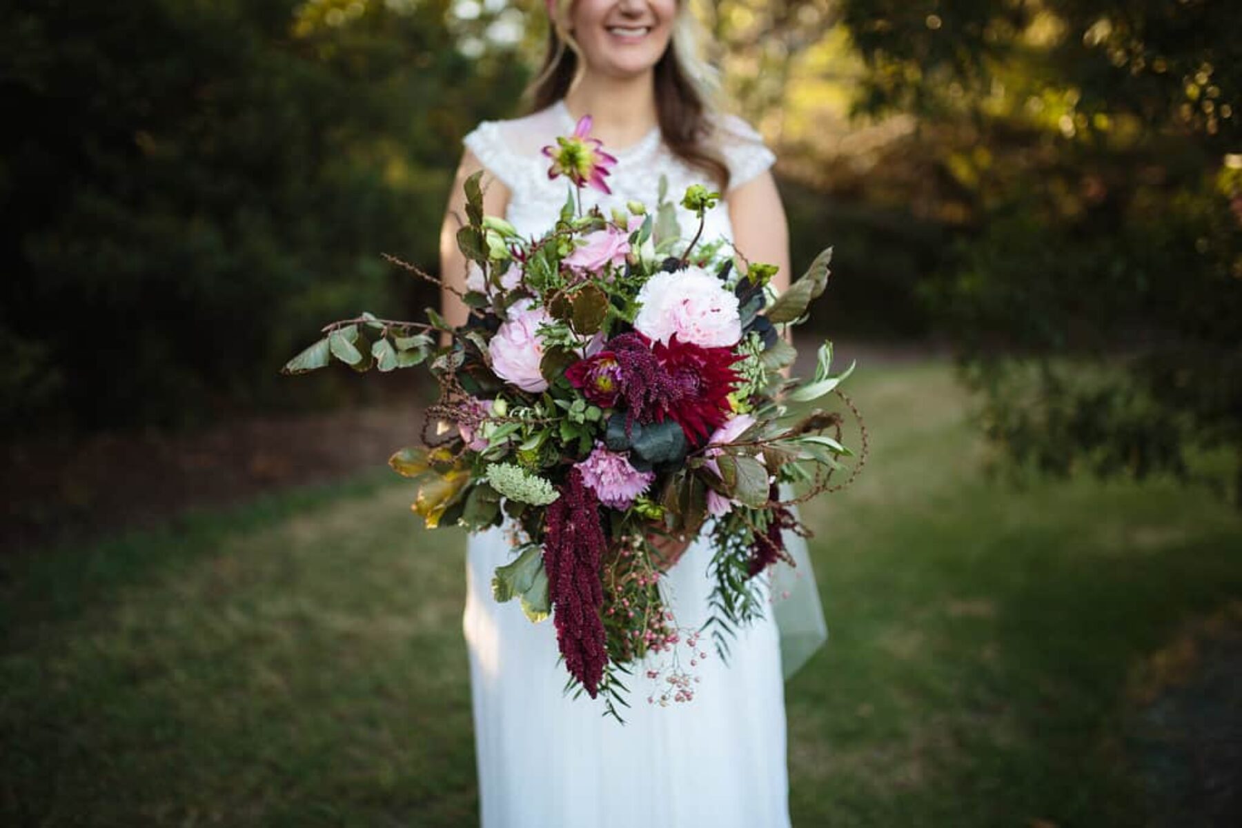 mixed pink bridal bouquet with dahlias and amaranth