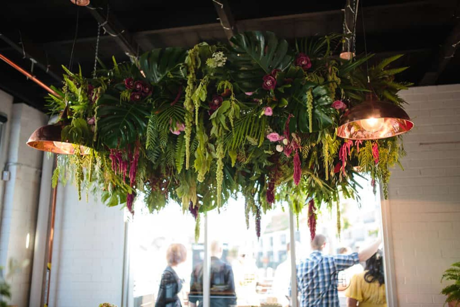 modern floral installation with copper lights