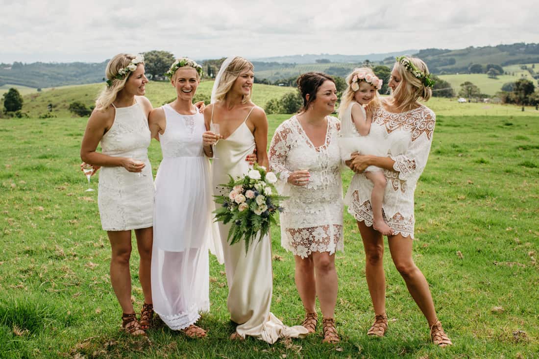 Bridesmaids in mixed white dresses