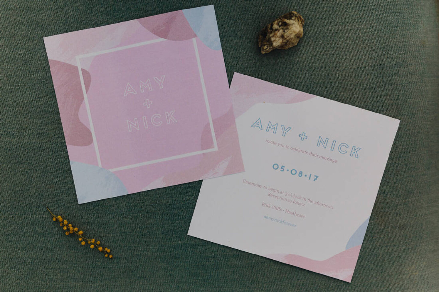 pastel pink and blue wedding invitation
