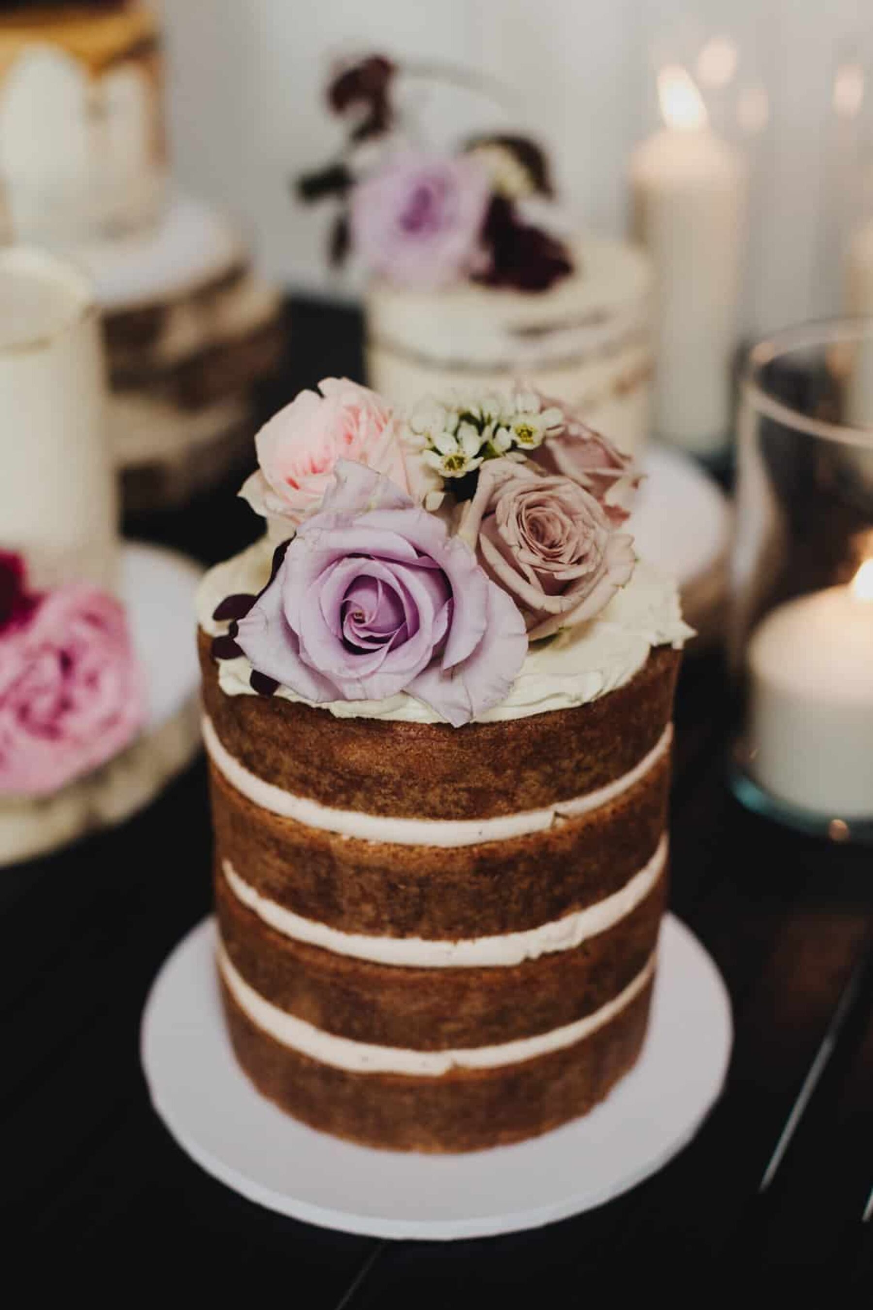 naked layer cake with fresh roses