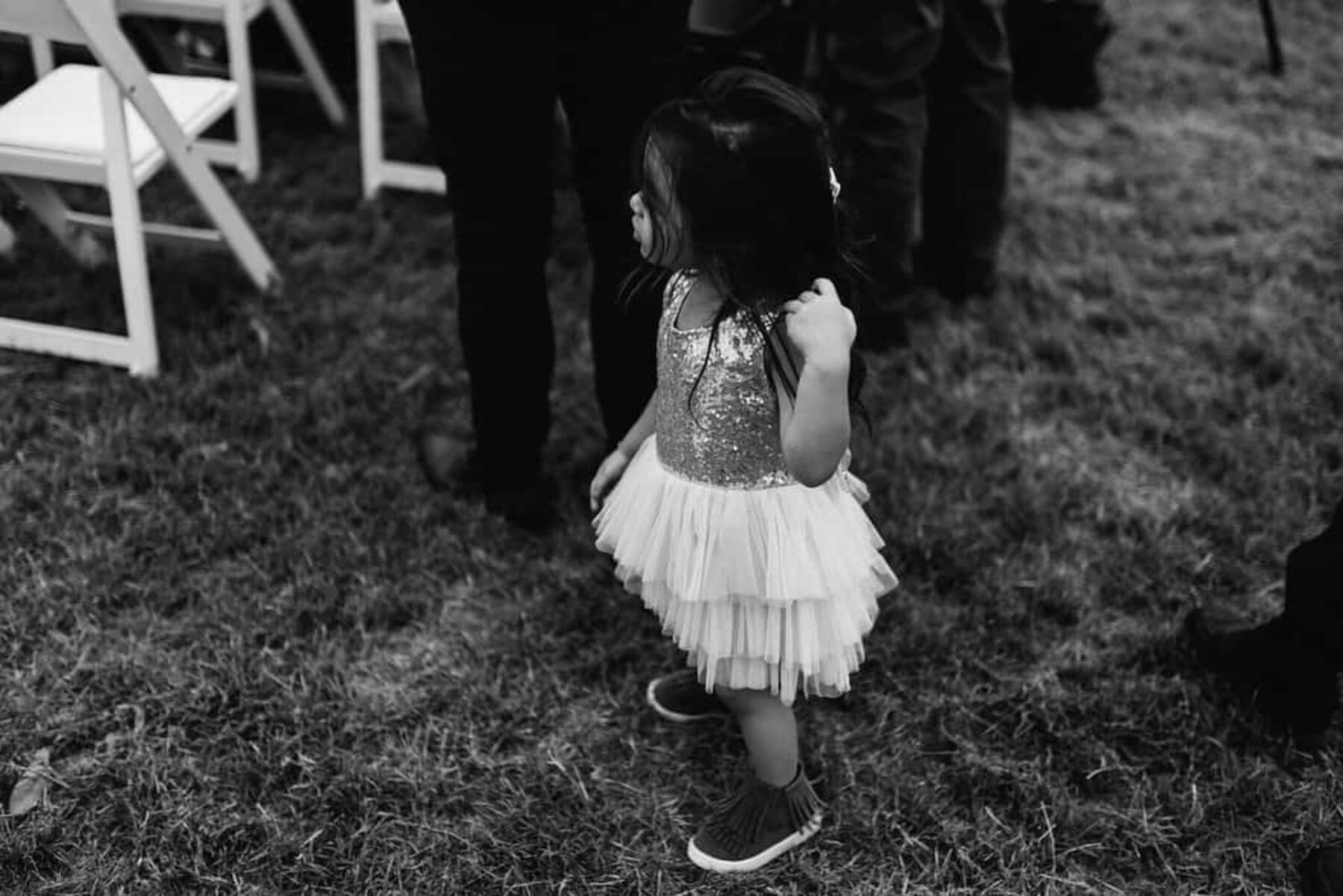 flower girl in sparkly tutu and sneakers