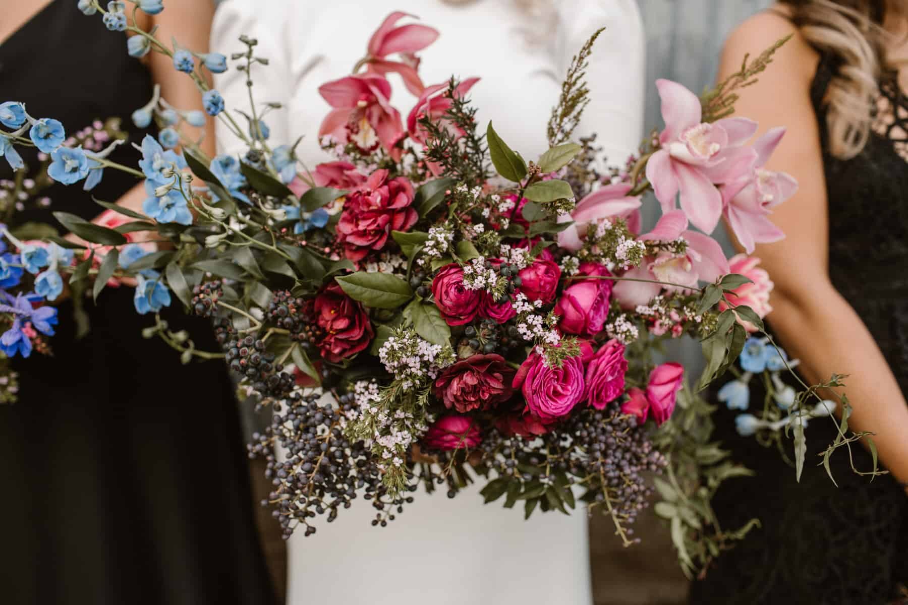 wild unstructured bouquet with pink roses and orchids