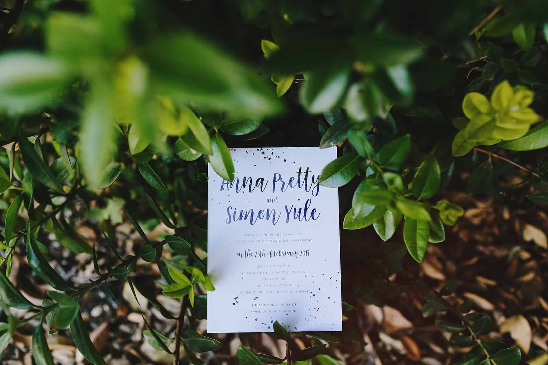Simple typographic wedding invitation with confetti