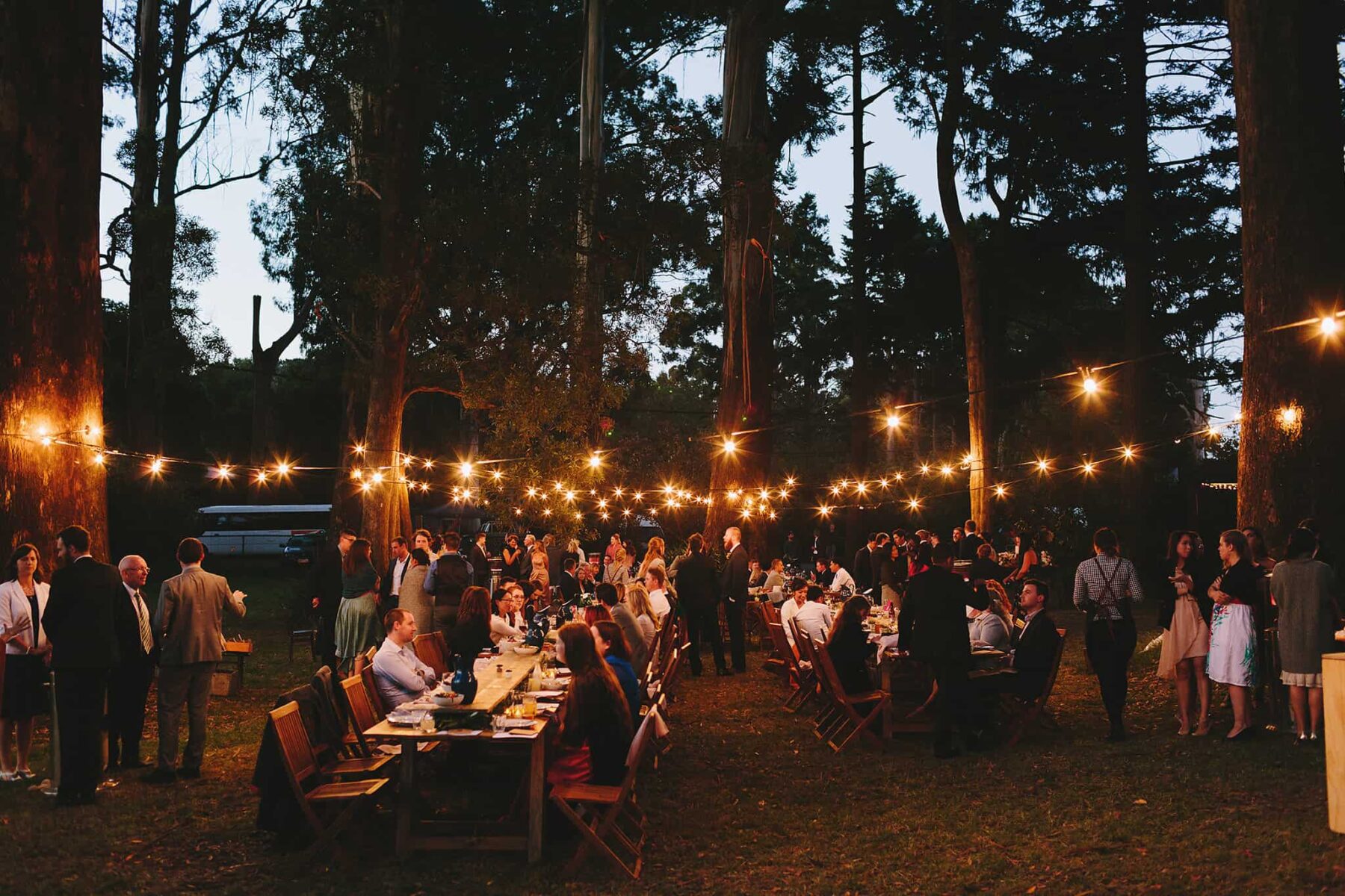 outdoor wedding with festoon lighting
