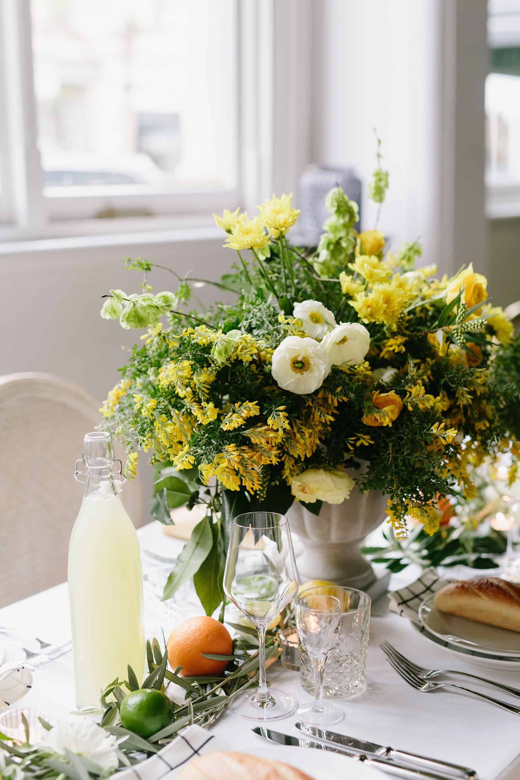 modern wedding tablescape with citrus and olive leaves
