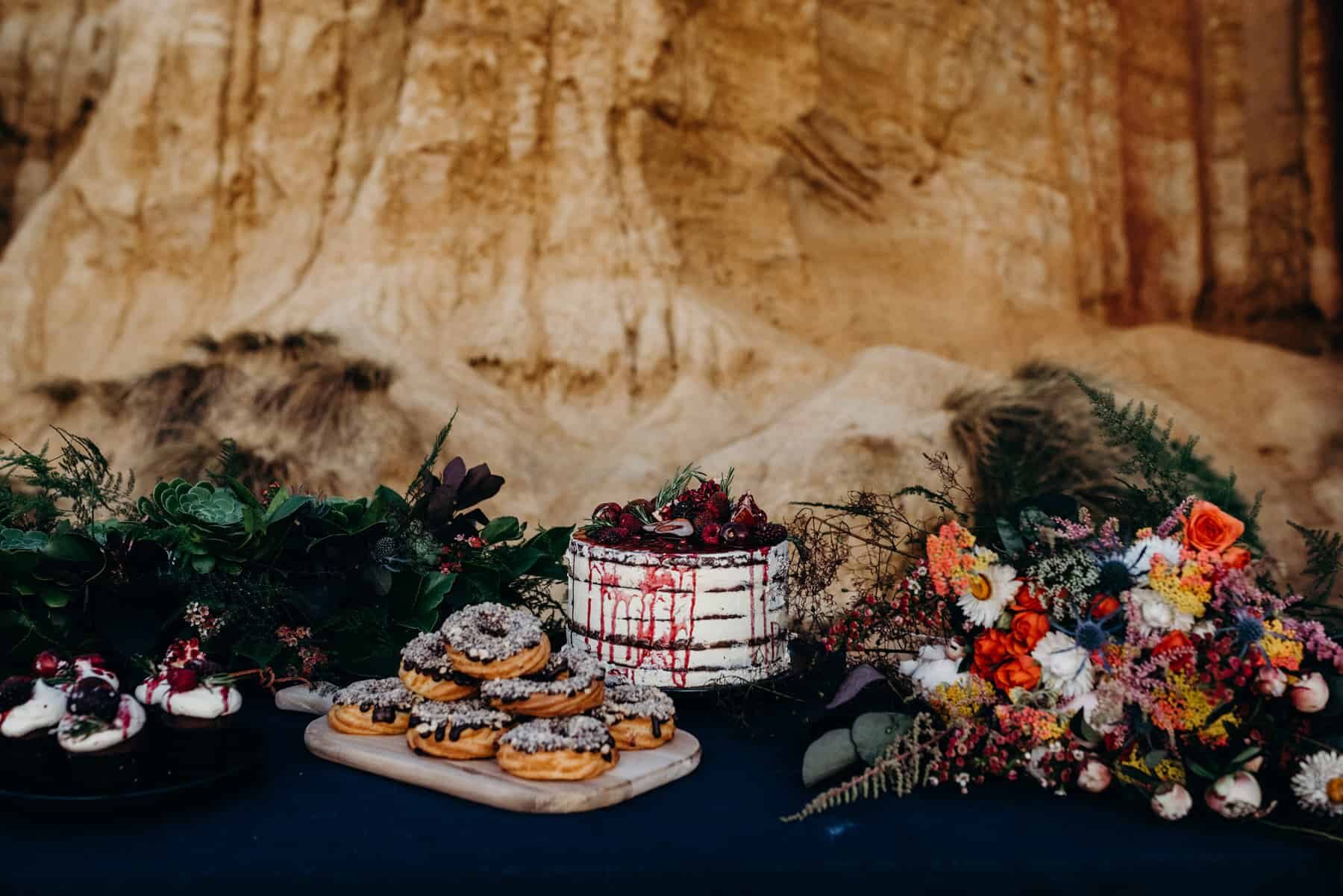 amazing dessert table set up on the beach